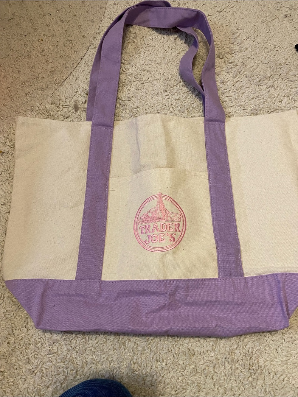 Colleen Hoover  books with Trader Joe’s bag